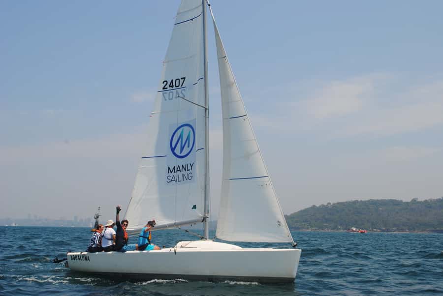 From Manly: Sydney Harbour Hands-On 2.5 Hour Yacht Cruise - Helping with the sails and taking the helm