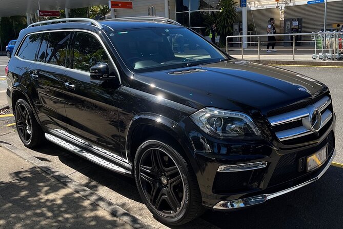 Private Transfer FROM Sydney Airport to Sydney CBD for 1 to 2 pax - Meeting your driver after customs