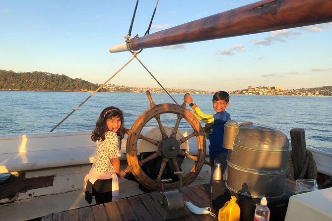 Sydney Harbour Tall Ship Afternoon Discovery Cruise - Hoisting sails on a timber ship