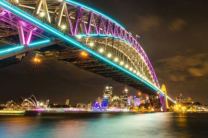 Vivid 90-Minute Sydney Harbour Catamaran Cruise with BYO Drinks - Under the Harbour Bridge with Vivid lights overhead